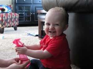 Lily was spraying herself with a little help from Dad...